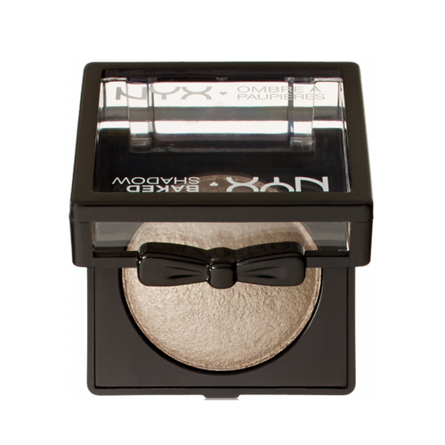 NYX baked powder with a black bow design on a white background shimmer light gold white eyeshadow 