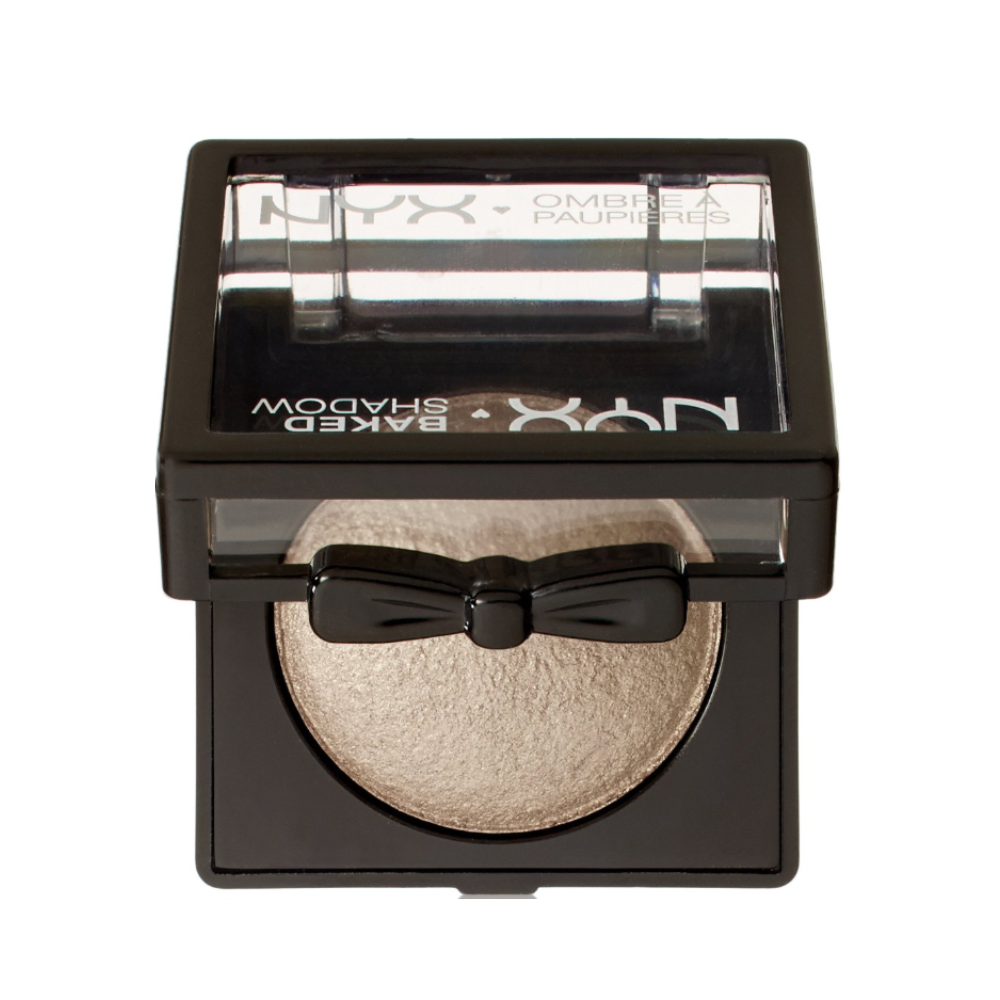 NYX baked powder with a black bow design on a white background shimmer light gold white eyeshadow 